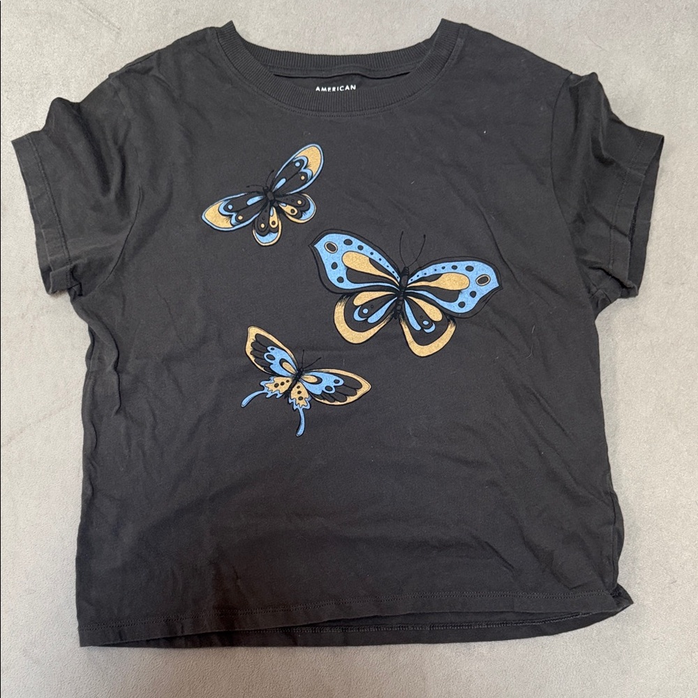 American Eagle Outfitters Black Tee with Blue and Gold Butterflies